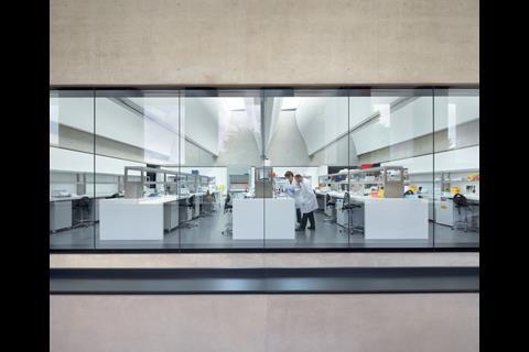 The laboratories are flooded with natural light from curvaceous light wells that seem to mimic scientific flasks.